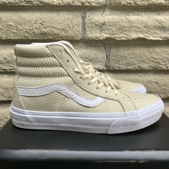 cream colored high top vans